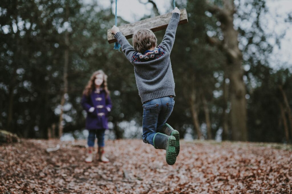 Children Playing with a Swing. Credit: Annie Spratt on Unsplash